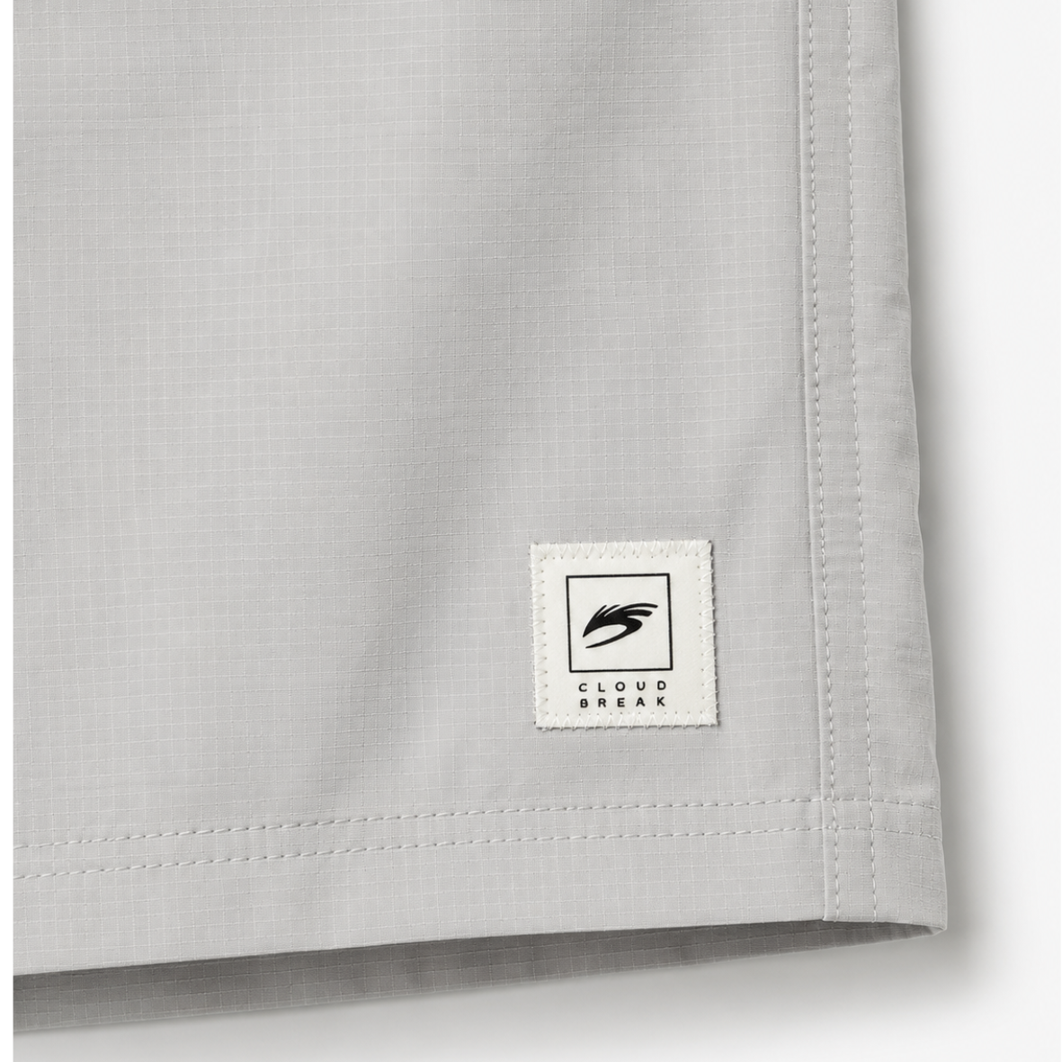 Gray shorts with a brand logo on a white background