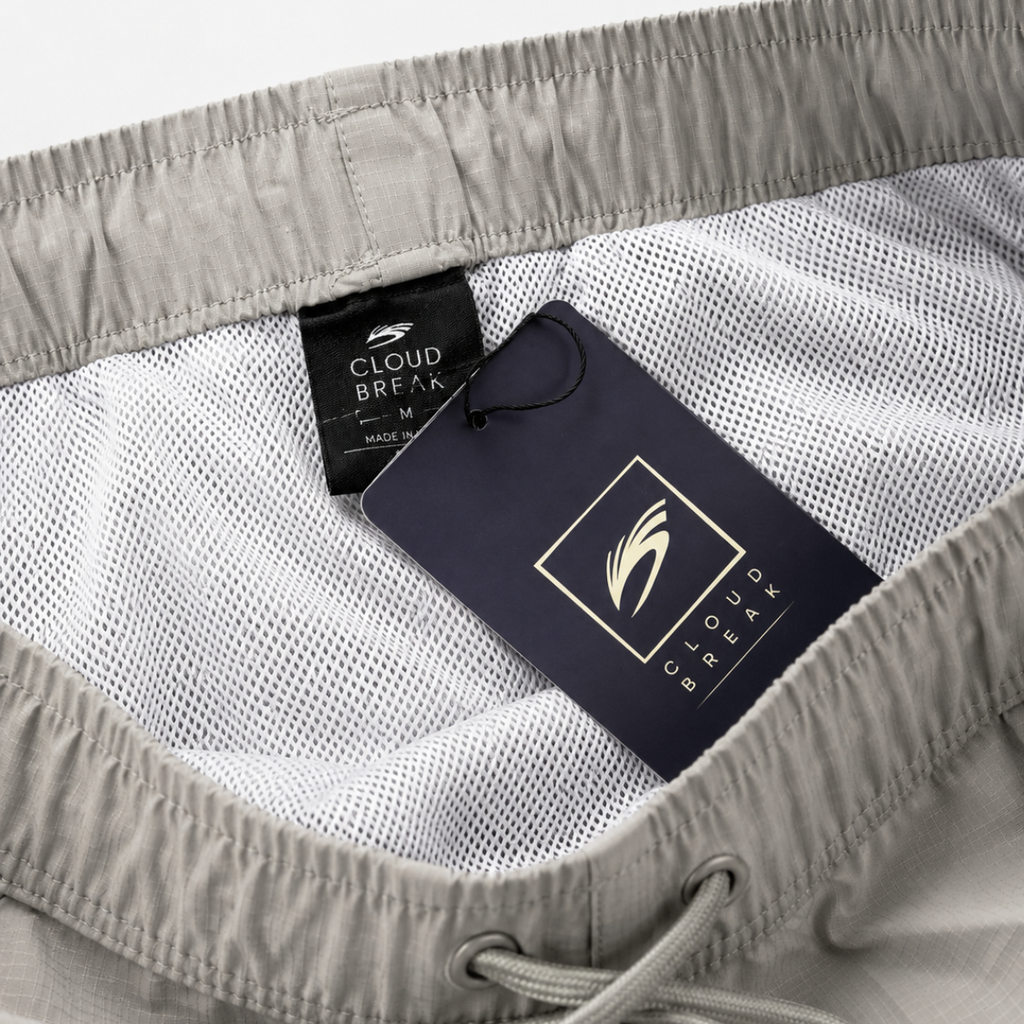 Gray shorts with a brand tag on a white background